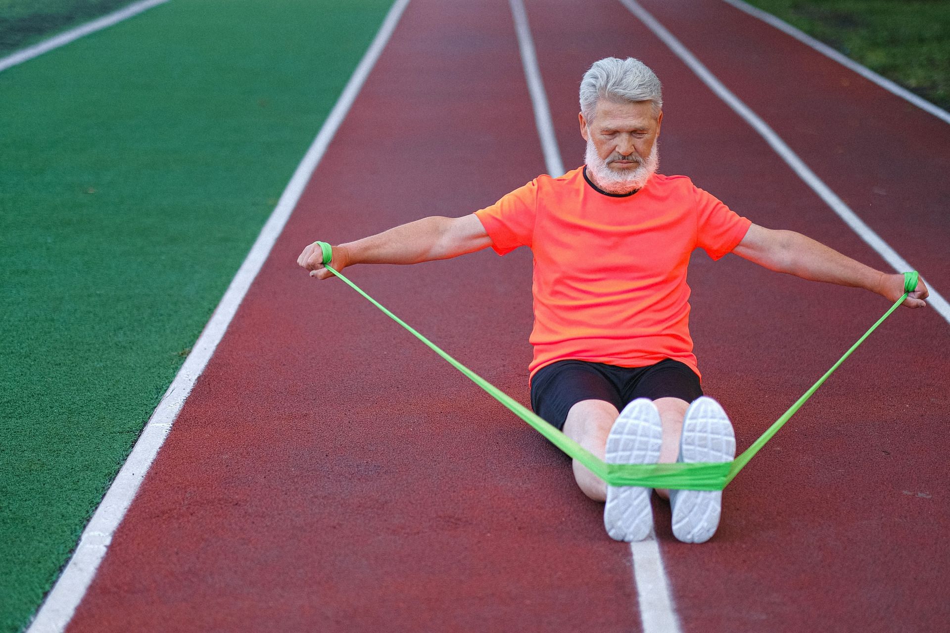 Band pull-aparts are a great way to strengthen the back. (Image via Pexels/Anna Shvets)